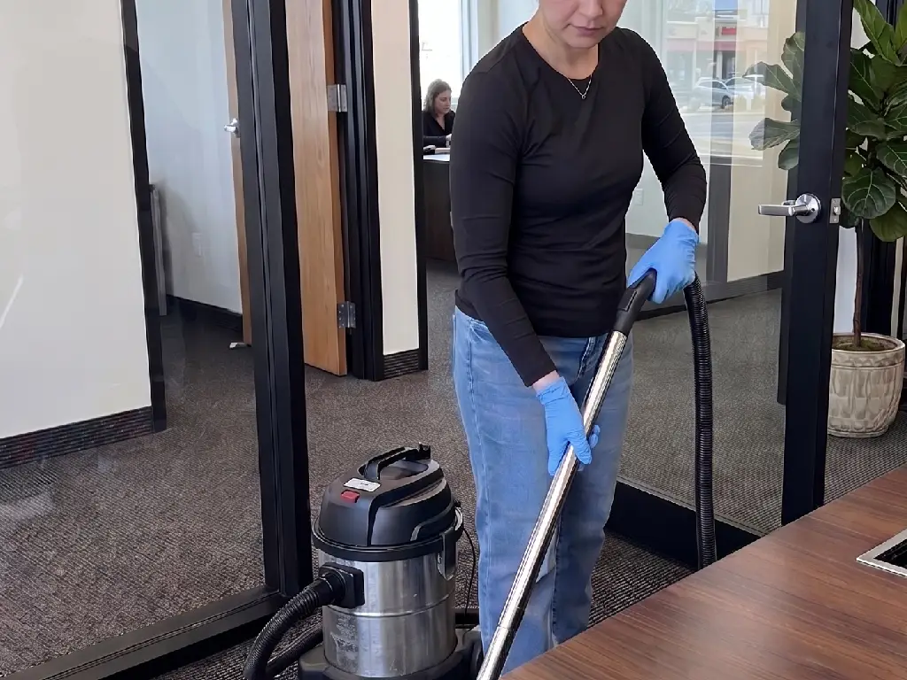 Bright, modern office with tidy desks, clean floors, and sanitized workstations